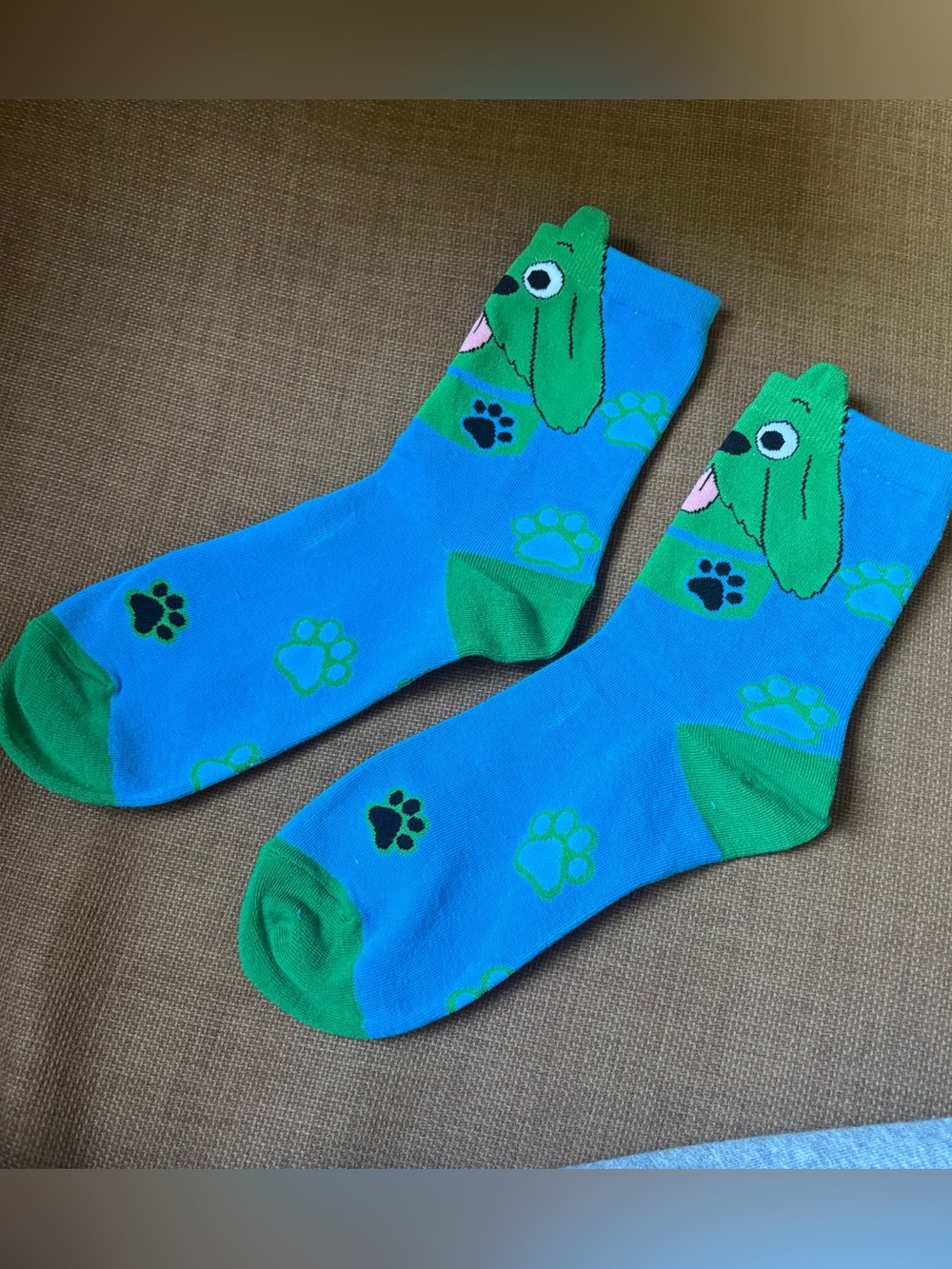 Blue & green dog socks with green dog faces and black paw prints #doglovers #paw